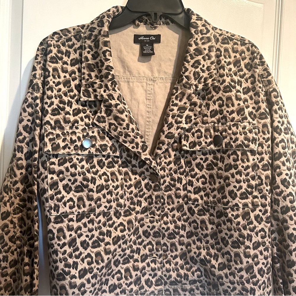 Anna Cai New York -Medium animal print button down jacket. Pockets on front.